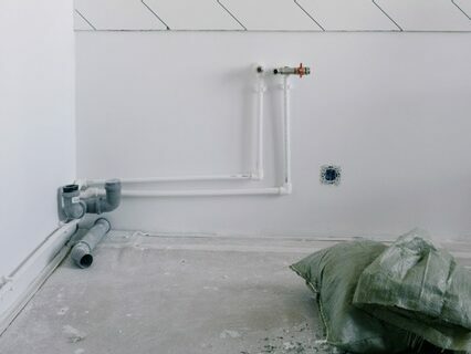 White plastic piping in a recently renovated apartment